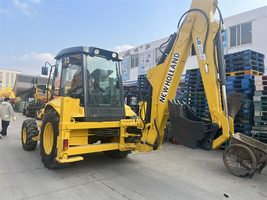 Dipakai New Holland LB95B-4PT Backhoe Loader dengan 4-in-1 Multipurpose Bucket, Pilot Controls, dan ROPS/FOPS Cab Enclosed